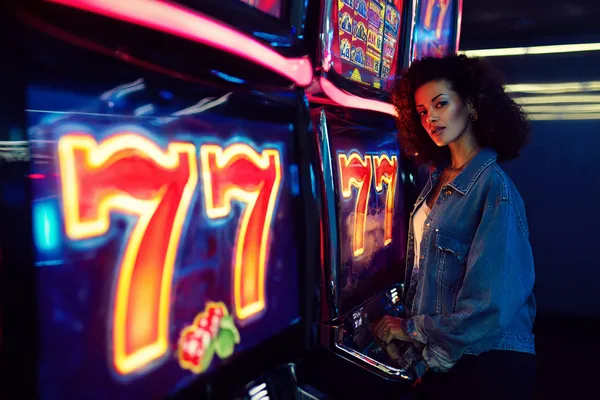 A cheerful woman in traditional clothing using her smartphone during a festive moment, showing how easily the PHILPOWER app fits into everyday life.